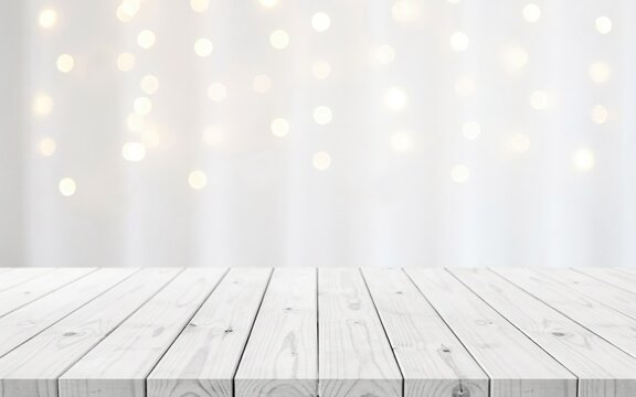 White wooden table surface with blurred warm fairy lights background