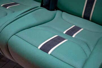 Fototapeta premium A comfortable seat for city bus passengers made of perforated eco-leather. Modern materials ensure a comfortable ride.