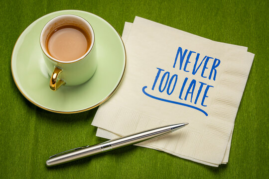 Never Too Late &ndash; inspirational handwritten note in a spiral sketchbook beside a cup of coffee, symbolizing hope, new beginnings, second chances, personal growth, and lifelong opportunity.