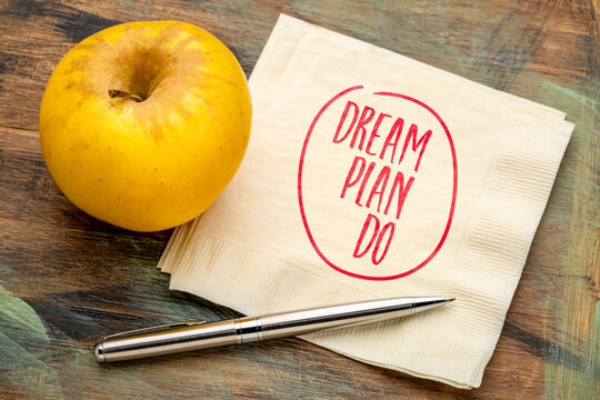 Dream. Plan. Do. &ndash; inspirational handwritten note on a napkin with coffee and pen, encouraging vision, goal setting, and taking action.