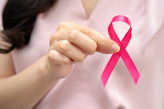 Asian woman with pink ribbon, World Breast Cancer Day at October.