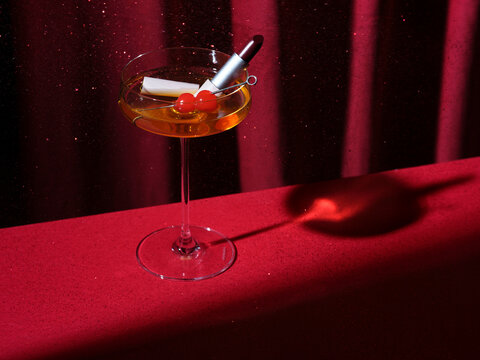 A cocktail glass with cherries on a stick and make up against curtains
