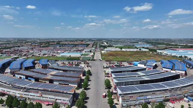 Aerial view of Rizhao industrial park with solar panel rooftops and orderly infrastructure