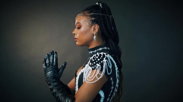 Fantasy portrait african american sexy woman queen priestess of night. tiara diadem crown silver moon head. Creative black dress. Voodoo girl pagan raised hands folded in prayer. halloween costume