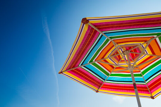 colorful beach umbrella and blue sky