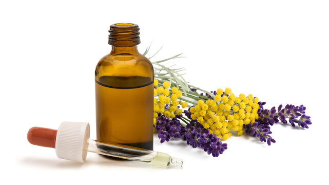 Helichrysum and lavender flowers with Essential Oil Bottle and Dropper