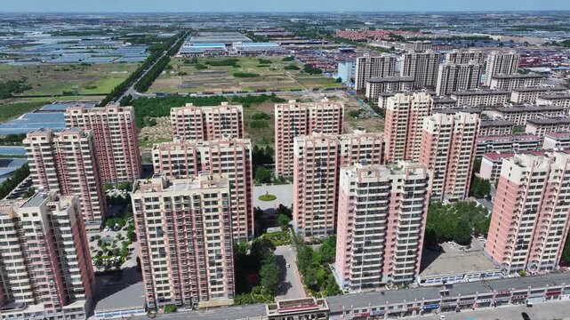 Aerial view of high-rise residential complex in Rizhao with modern apartment buildings and surrounding greenery