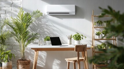 Fototapeta premium Sunlit home office with a laptop on a wooden desk and wall mounted air conditioner. Cozy workspace filled with green potted plants and natural light