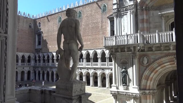 Marble Statue with St. Mark's Basilica and Doge's Palace Courtyard, Venice, Italy
