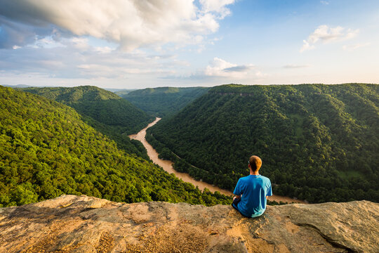 man on top of mountain