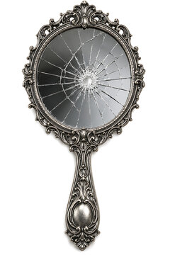Vintage broken hand mirror with ornate silver frame, shattered glass handheld mirror, antique vanity accessory with cracks and damage isolated on White Background ai