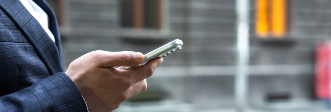 Businessman making a phone call to complete a deal, symbolizing modern communication, negotiation, corporate strategy, and fast-paced financial decision-making in business environment.