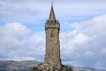 Fototapeta premium A tall clock tower building in the city, suitable for use as an iconic landmark or background image