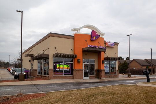 Okemos, Michigan, USA - March 30, 2022: A Taco Bell restaurant building on Jolly Rd, Okemos, MI, USA. Taco Bell is an American multinational chain of fast food restaurants. 