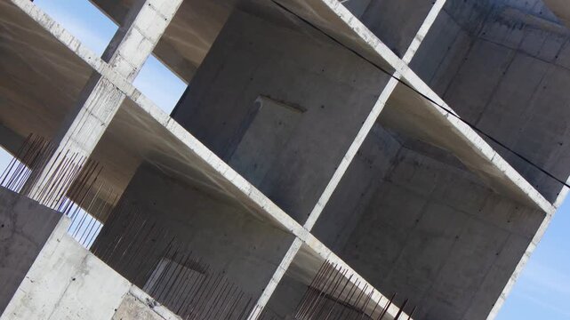 Authentic concrete structure, slab building. Reinforced concrete construction. Industrial concrete structure. Construction site.