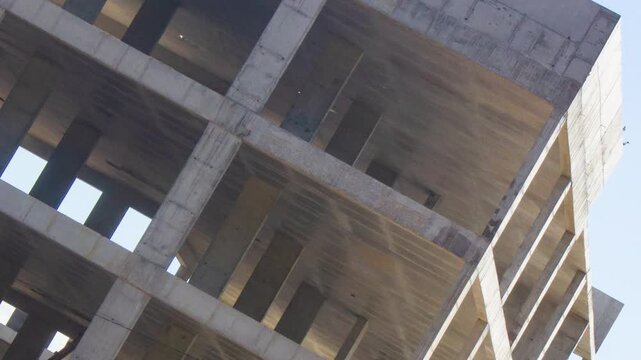 Authentic concrete structure, slab building. Reinforced concrete construction. Industrial concrete structure. Construction site.