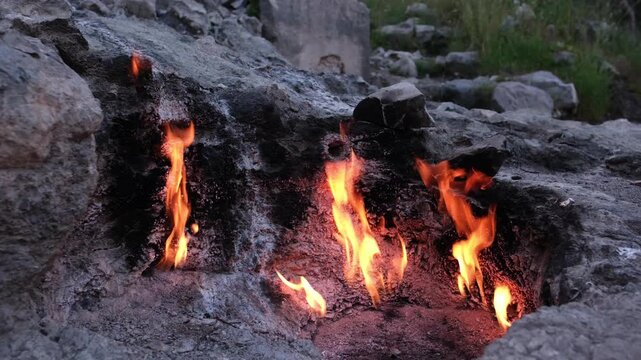 The eternal flames of Mount Chimaera (Yanartas) near Cirali, Turkey. A natural phenomenon where methane gas burns spontaneously from crevices in the rocky mountainside