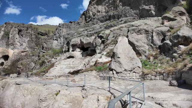 Vardzia cave monastery complex features carved medieval dwellings and religious structures into the Erusheti Mountain hillside in Georgia