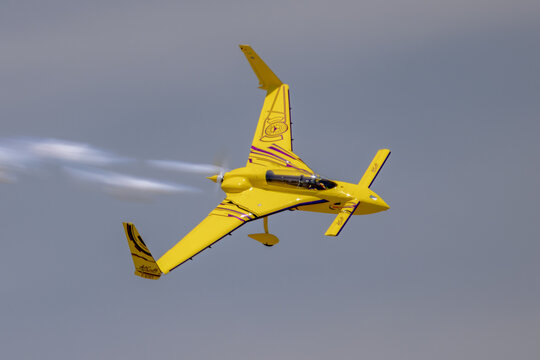 Kyle Fowler Long-EZ aerobatic aircraft rolling with smoke