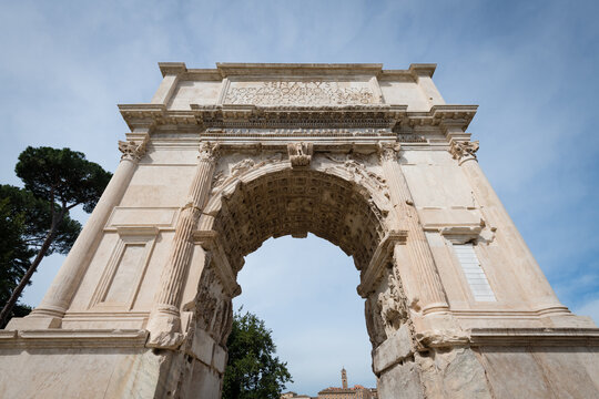 The ancient Roman Arch of Titus featuring the famous Latin inscription at the Forum Romanum in Rome, Italy