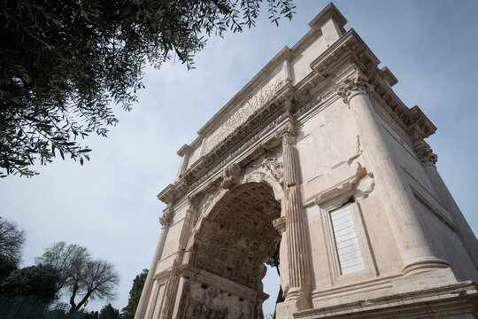 The ancient Roman Arch of Titus featuring the famous Latin inscription at the Forum Romanum in Rome, Italy