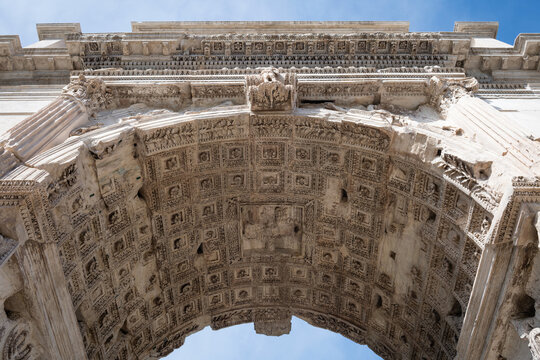 Detailed low angle view of the decorated coffered ceiling inside the ancient Roman Arch of Titus at Forum Romanum in Rome, Italy