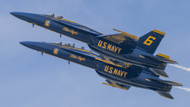 Two Blue Angels F/A-18 Super Hornets flying close formation