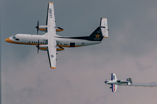 Fokker C-31A Troopship flying above aerobatic aircraft