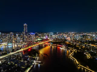 Aerial view of Brisbane city and Story bridge at night © anderm