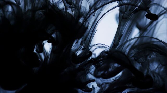 Ink Swirls in Slow Motion with Dark Blue and Black Tones Creating Abstract Patterns Featuring Fluid, Dynamic, Artistic with Creative and Design