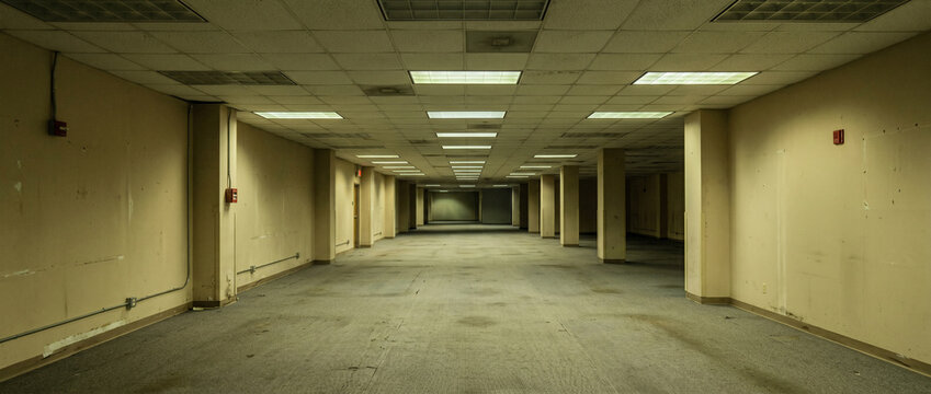Empty Commercial Storage Room Interior with Fluorescent Lighting and Liminal Atmosphere