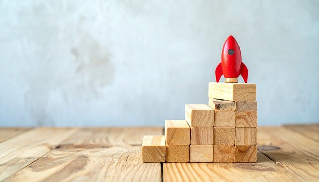 Red rocket on wooden staircase symbolizing growth and success