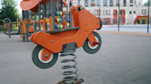 Empty horse rocker on springs in the park