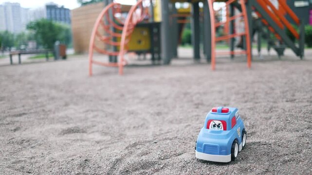 forgotten toy car on the playground, nice summer day