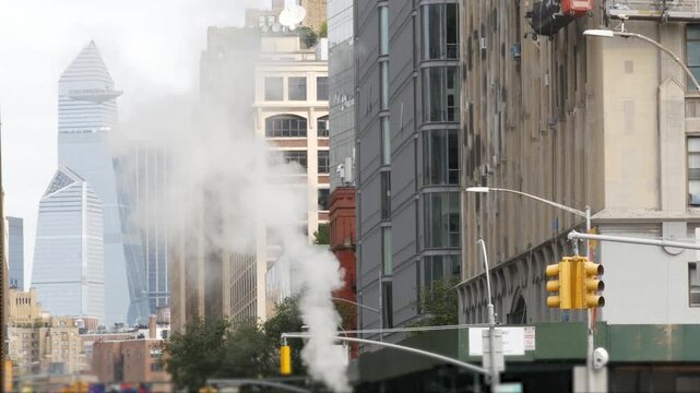 New York City Manhattan Midtown Hudson Yards district towers, United States of America. Urban skyscraper building, modern architecture in Chelsea. Cityscape from Varick street. Hot steam, vapor smoke.