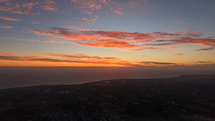 Obraz premium Vibrant sunset colors over the coastline of Reunion Island