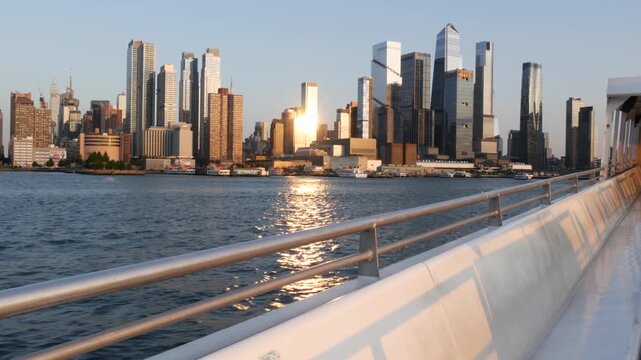 New York City Manhattan Midtown skyline, Hells kitchen and Hudson Yards from New Jersey, ferry boat from Weehawken Port Imperial, United States. American urban cityscape with skyscraper building.