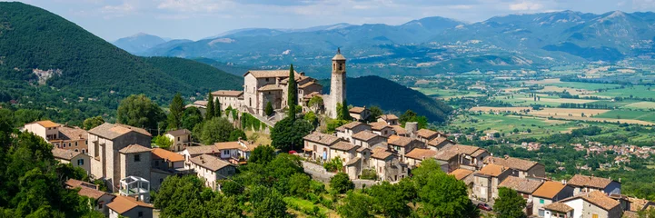 Greccio Rieti Italy High Resolution. 16k 3:1 drone panorama of narrow hilltop medieval borgo on 70mm lens with background valley and mountains. Borghi piu belli d Italia most beautiful villages © Freesurf