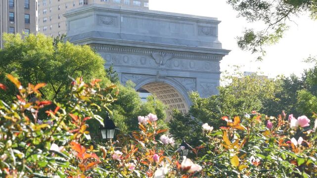 New York City Manhattan Washington Square Park arch, United States. Marble historic monument Greenwich Village. 5 fifth avenue triumphal arch. Autumn fall garden greenery. George Washington memorial.