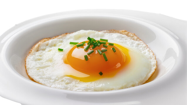 Fried egg with runny yolk and chives served in a white bowl, isolated on transparent background