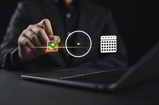 Person using laptop with digital icons of check mark  clock  and calendar  symbolizing task completion  scheduling  time tracking  and productivity management in a modern digital workflow.