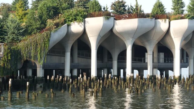 New York City Little Island pier park, oasis in Manhattan Midtown, United States. Urban architecture on pillars in Chelsea, USA. Futuristic contemporary concrete columns design, Hudson river landmark.