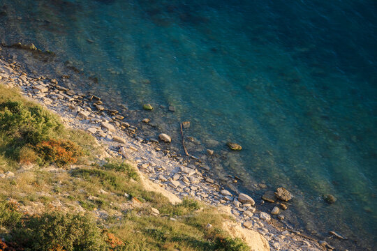 Drone view coastal landscape with turquoise sea and rocky shoreline