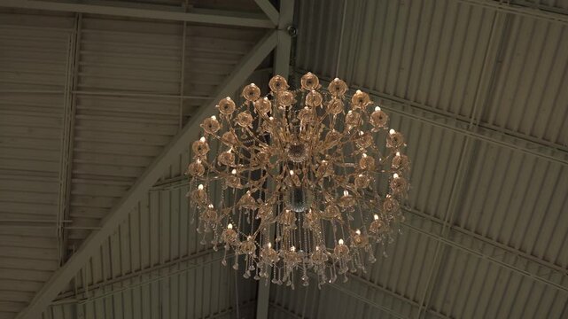 Crystal chandelier on high white ceiling