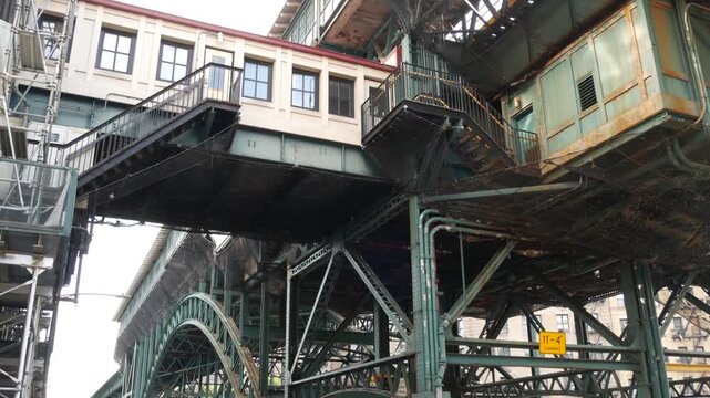 New York City 125 street elevated subway metro metallic bridge in Harlem, United States. American passenger transport, Upper Manhattan. Old outdoor metropolitan station, NYC USA. Historic architecture