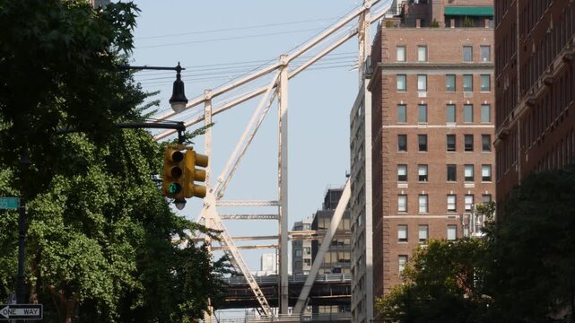 New York City Manhattan Midtown street, Queensboro bridge architecture, United States. Urban transport bridge and red brick residential buildings. Metallic bridge in East Side. Sutton Place traffic.