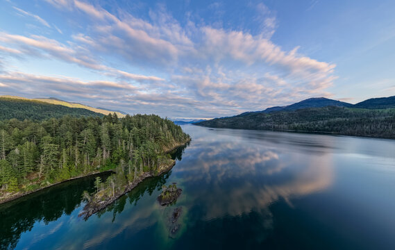 Aerial View of Harrison Lake Surrounded by Forested Mountains and Calm Reflections in British Columbia