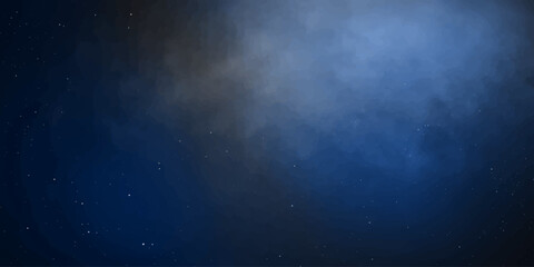 A deep blue celestial expanse is illuminated by ethereal wisps of cosmic dust and distant, twinkling stars, creating a breathtaking and mysterious nebula. © RD Visuals