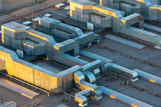 Aerial view of an advanced food production facility featuring complex ventilation systems and metallic ductwork on a flat roof in Piorunow, Masovian Voivodeship, Poland.