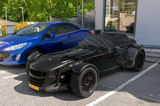Laxou, France - May 23rd 2026 : View on a black Donkervoort D8 GTO-S with black rims parked on a street.